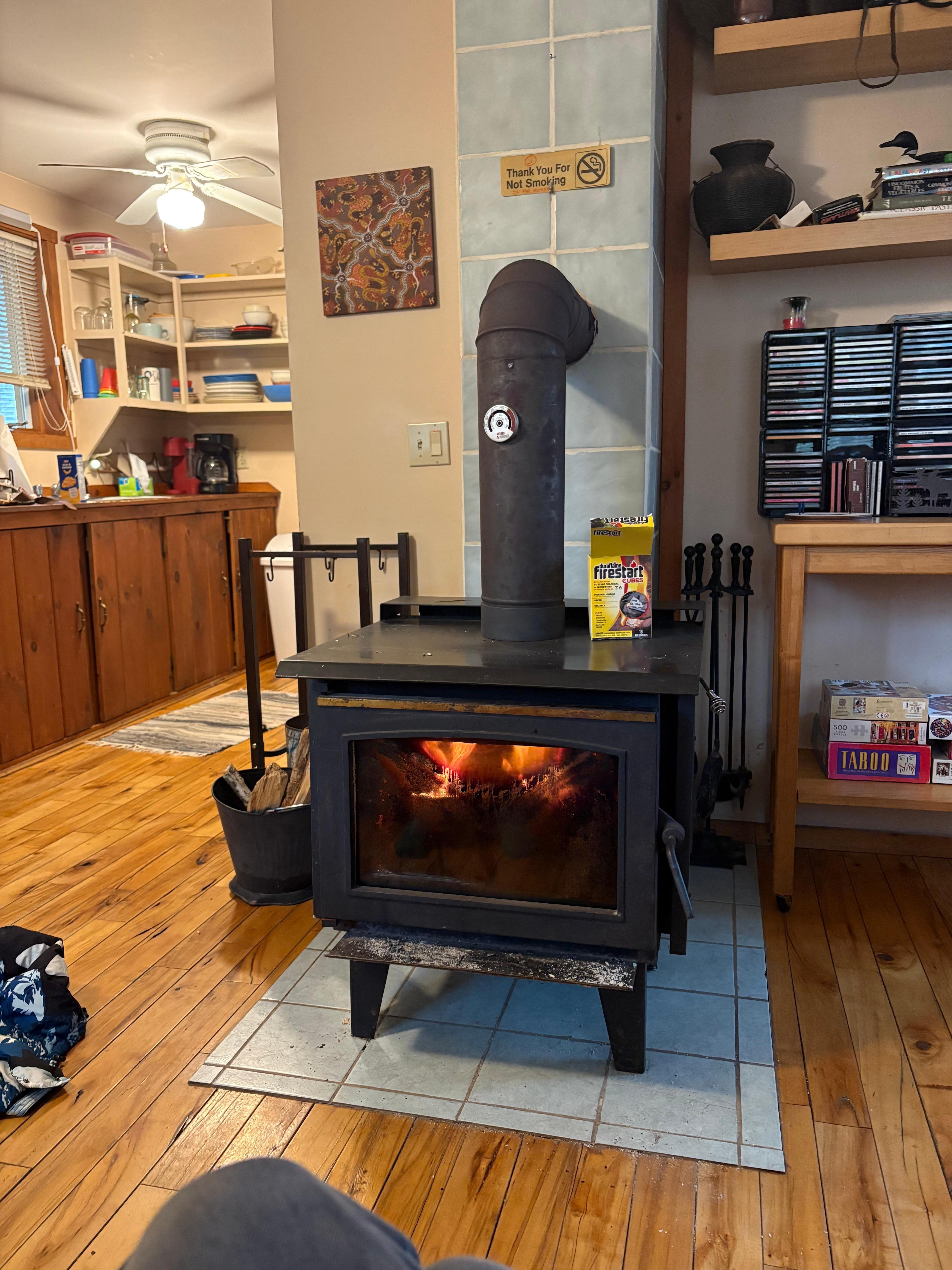 Wood stove burning bright after the snow started.