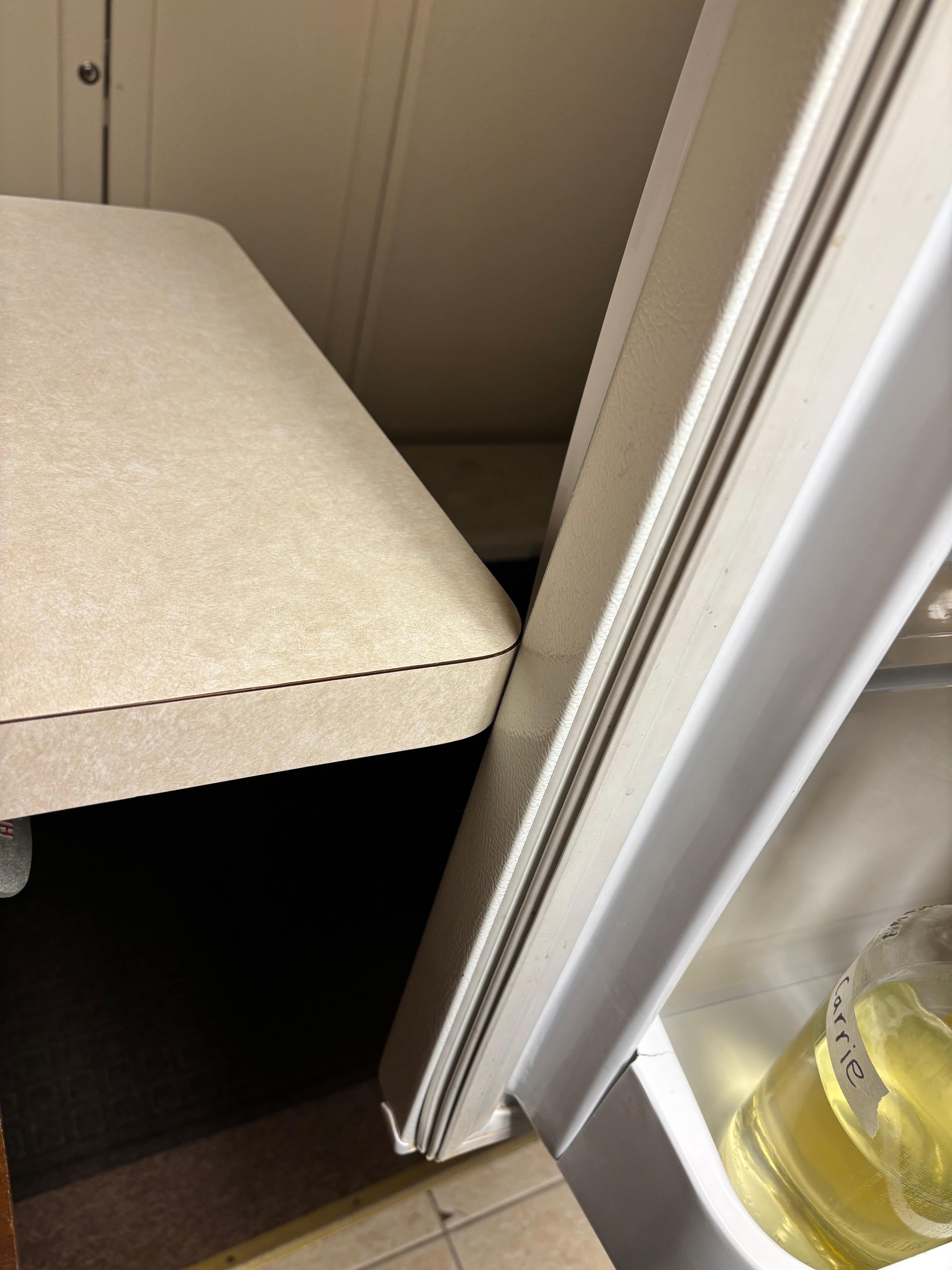 Refrigerator door hits counter