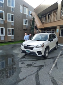 My daughter parked in front of our room.