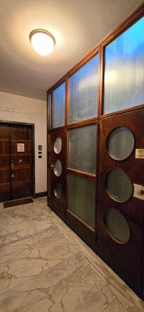 Period Otis elevator for two.