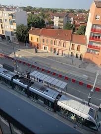 View of tram stop below from third floor deck