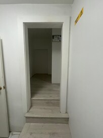 opening in wall (no door) to second bedroom. Only 5ft high.