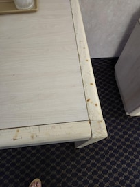 Look cloaer cigarrette burn all around the table