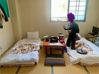 Cute room with tatami mats, comfy futon beds and cup of tea.