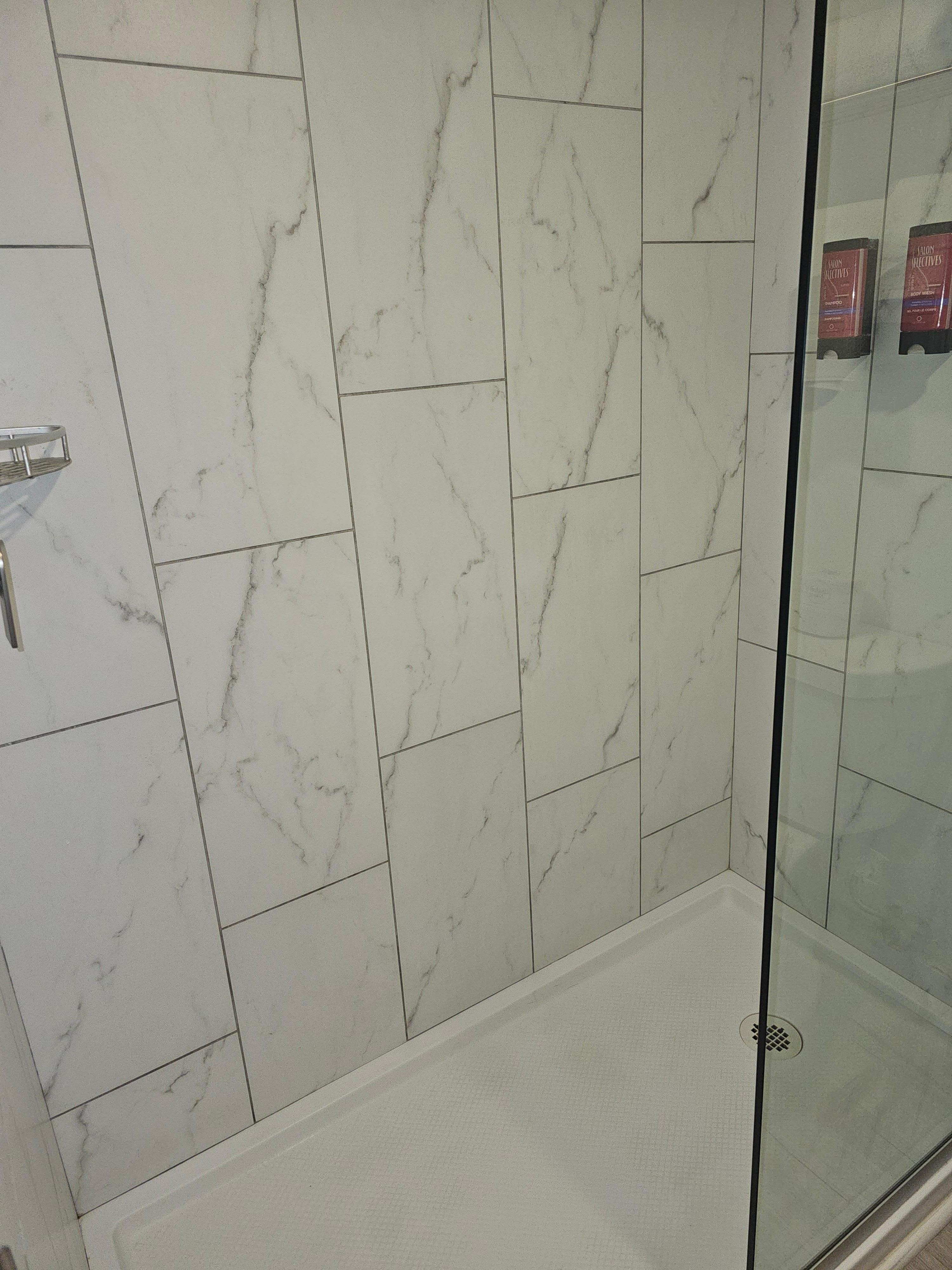 The shower on had one side with a door and the floor would get wet when taking a shower.