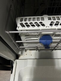 Food particles in dishwasher (we never used so wetness in from prior renter)