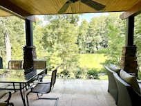 Large outdoor space with grill and comfy outdoor furniture