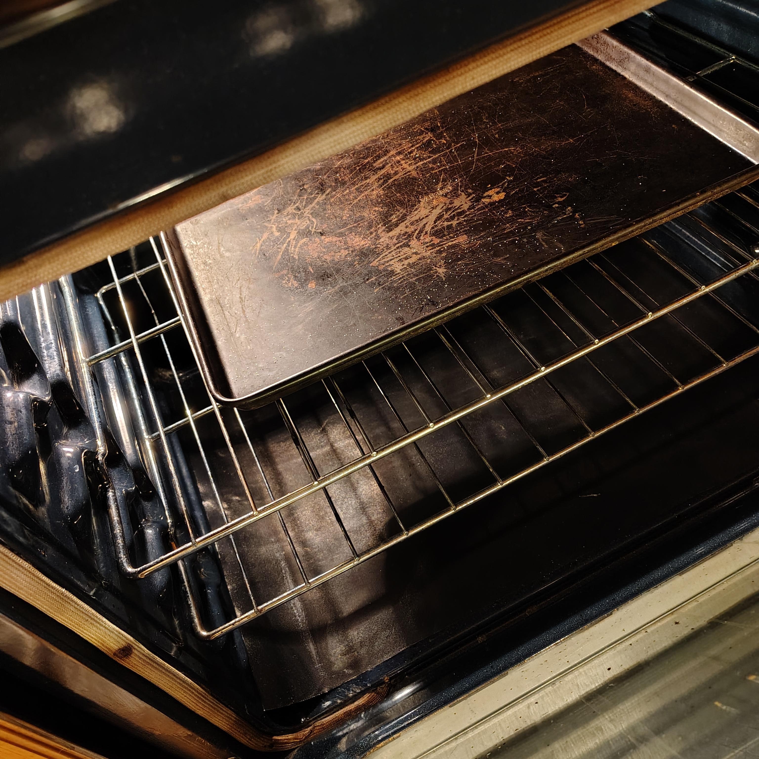 Dirty pan with salt all over it in the oven