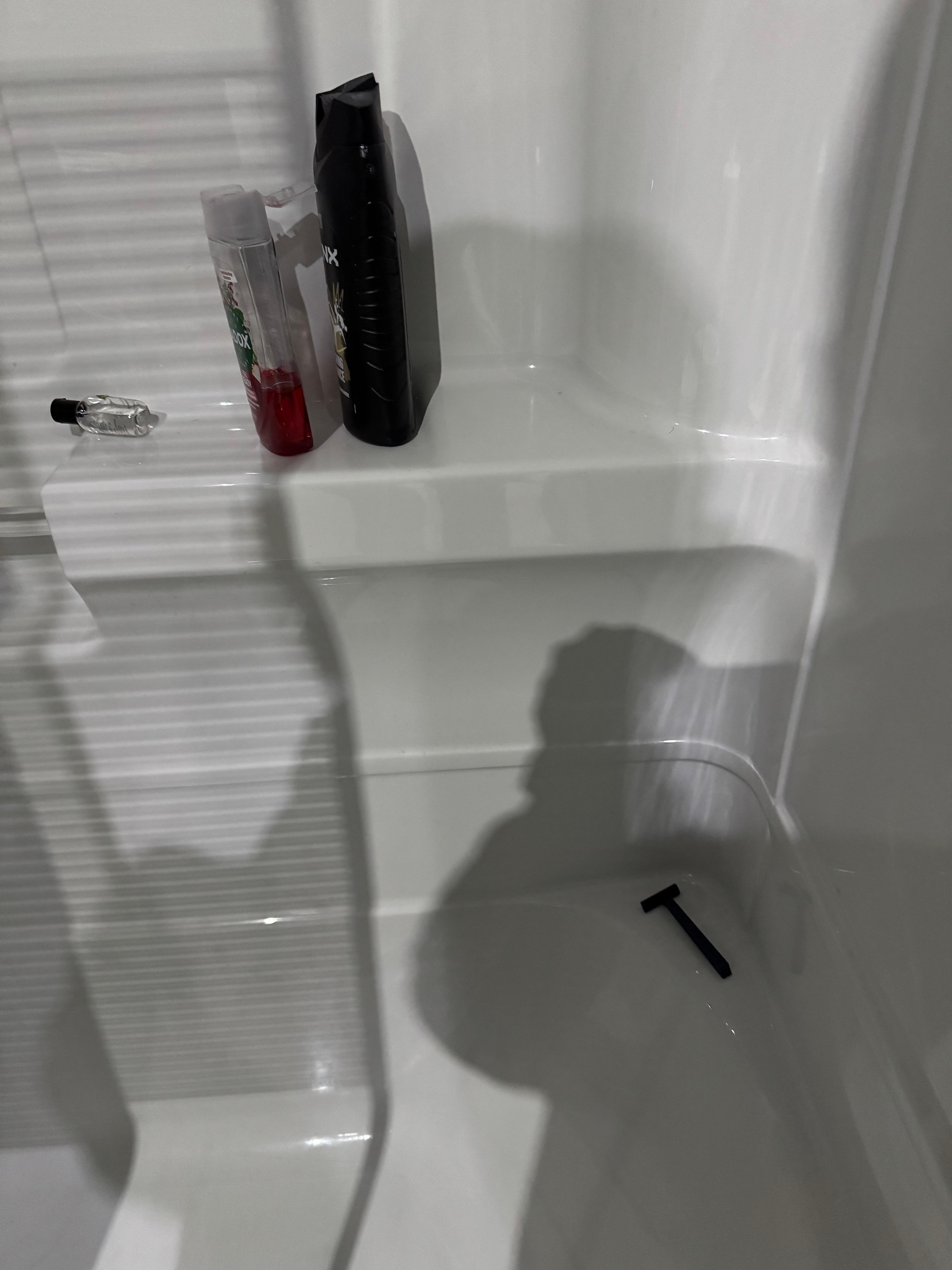 Shower plus previous guests used razor blade.