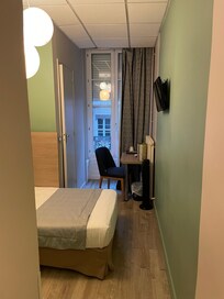 There is a small wardrobe on the left