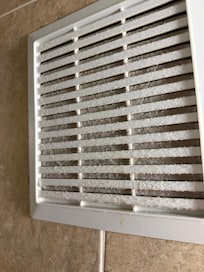 Dusty vent in bathroom. Good toilet paper though, which can be linty.
