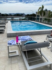 Lovely rooftop pool with comfortable outdoor furniture
