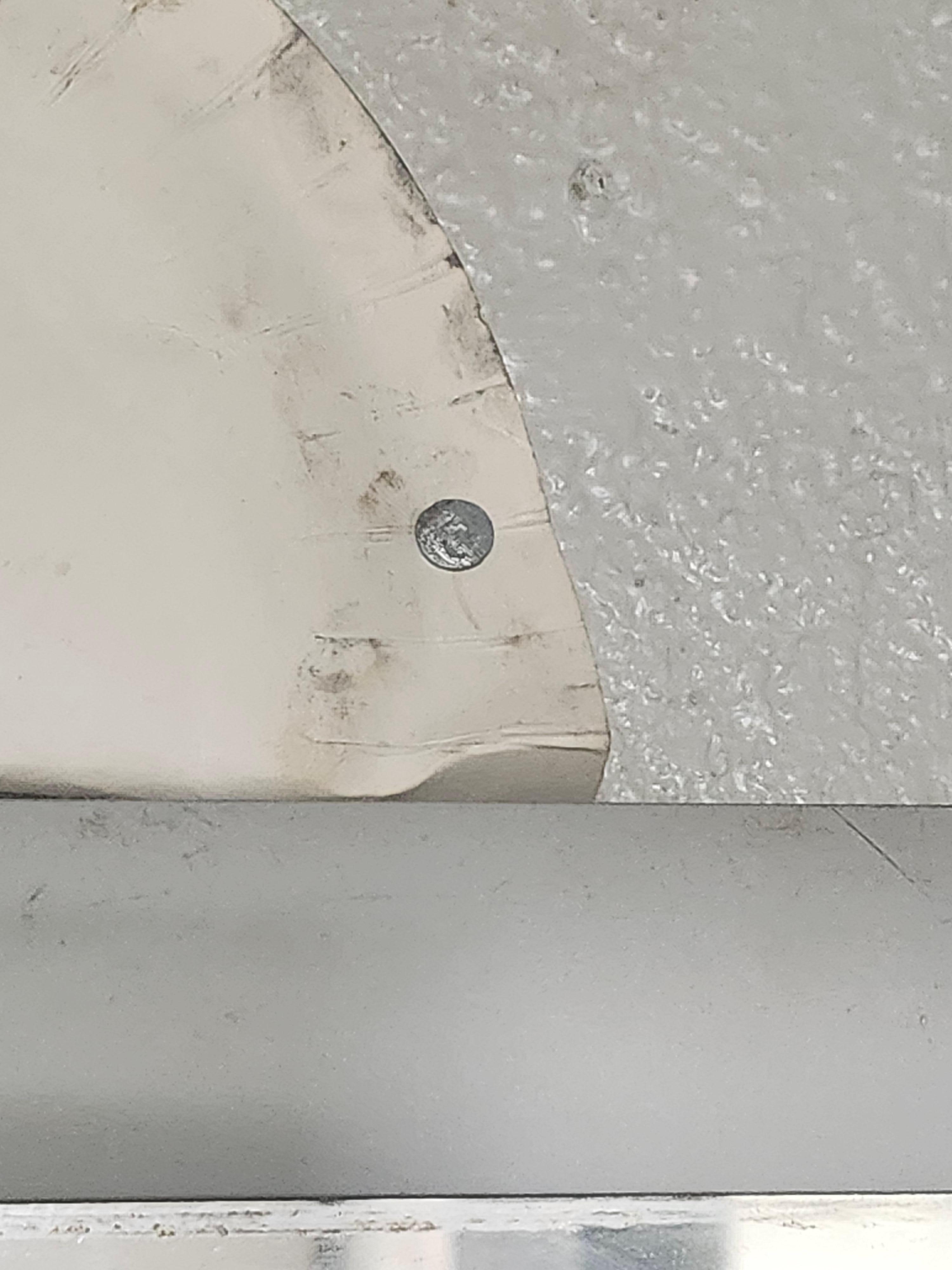 Paper plates nailed to wall