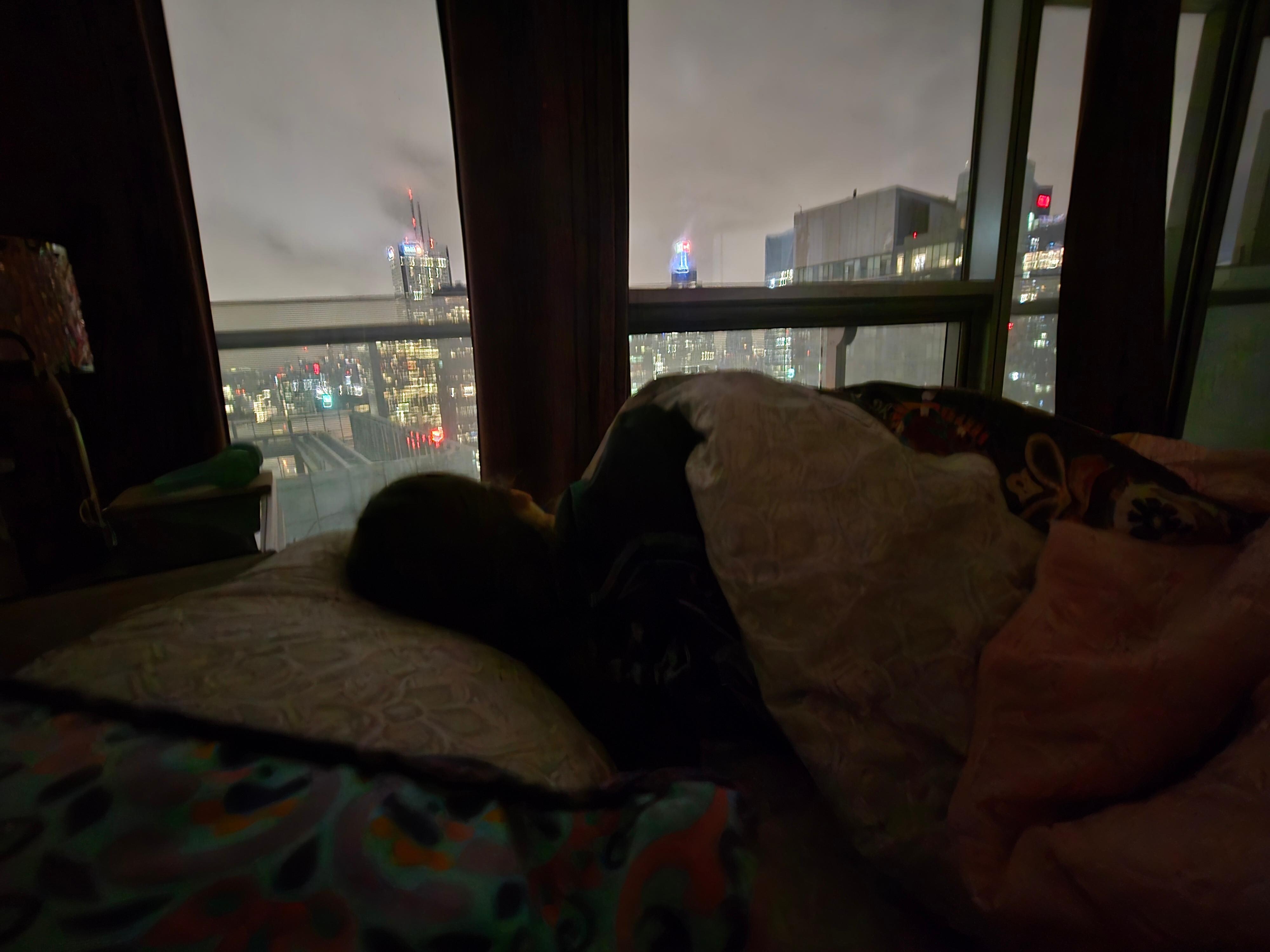 Laying in bed, you're looking over the city! There is also a balcony just big enough to stand on and look at the views! 