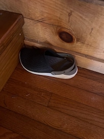Random shoe from a previous guest found under the couch