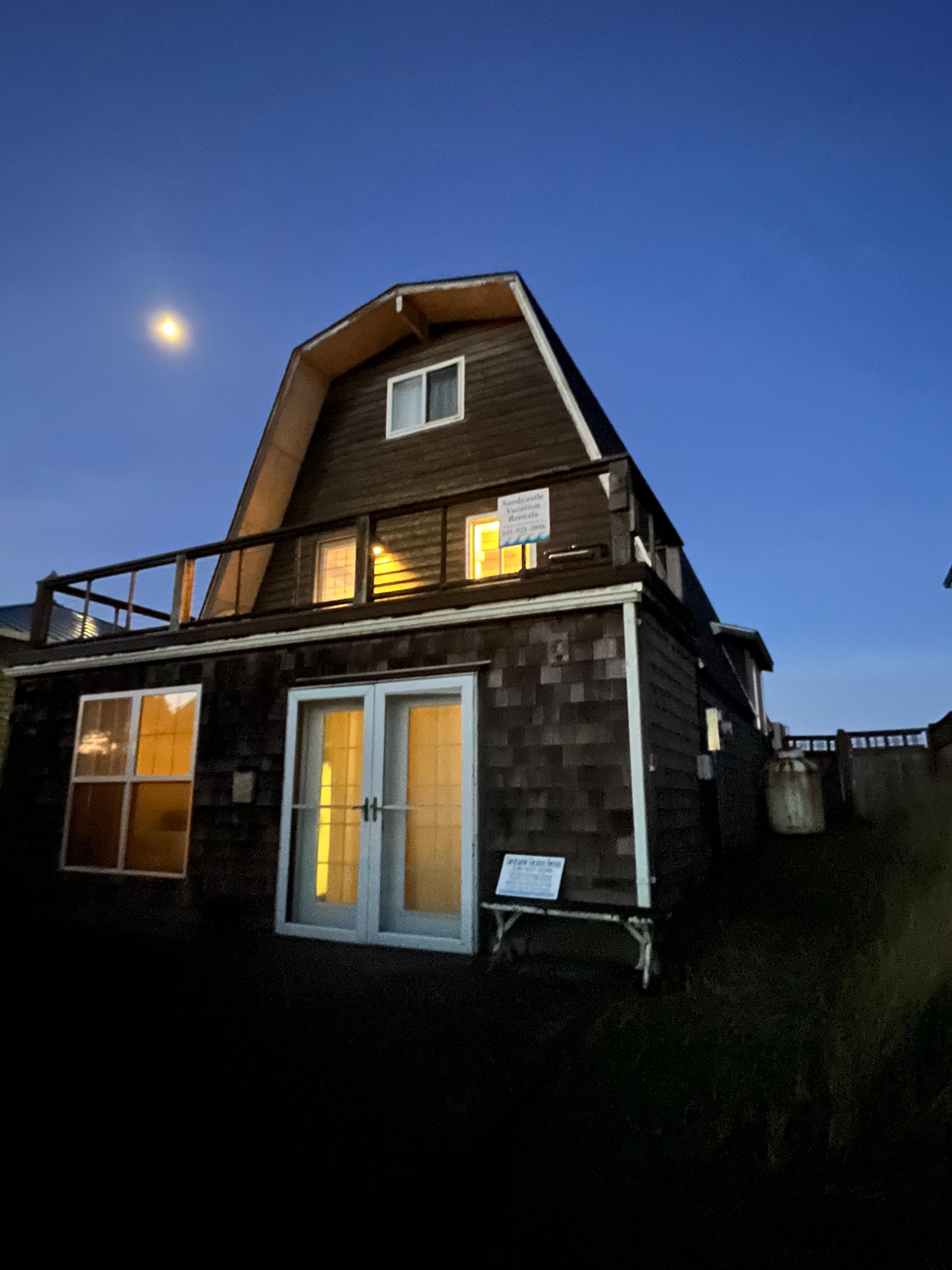 Side you approach from driveway. This balcony faces the neighborhood and river.