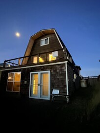 Side you approach from driveway. This balcony faces the neighborhood and river.