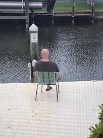 My husband watching the fish go by