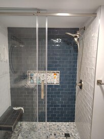 Love this shower. Rain head, bench, great size.