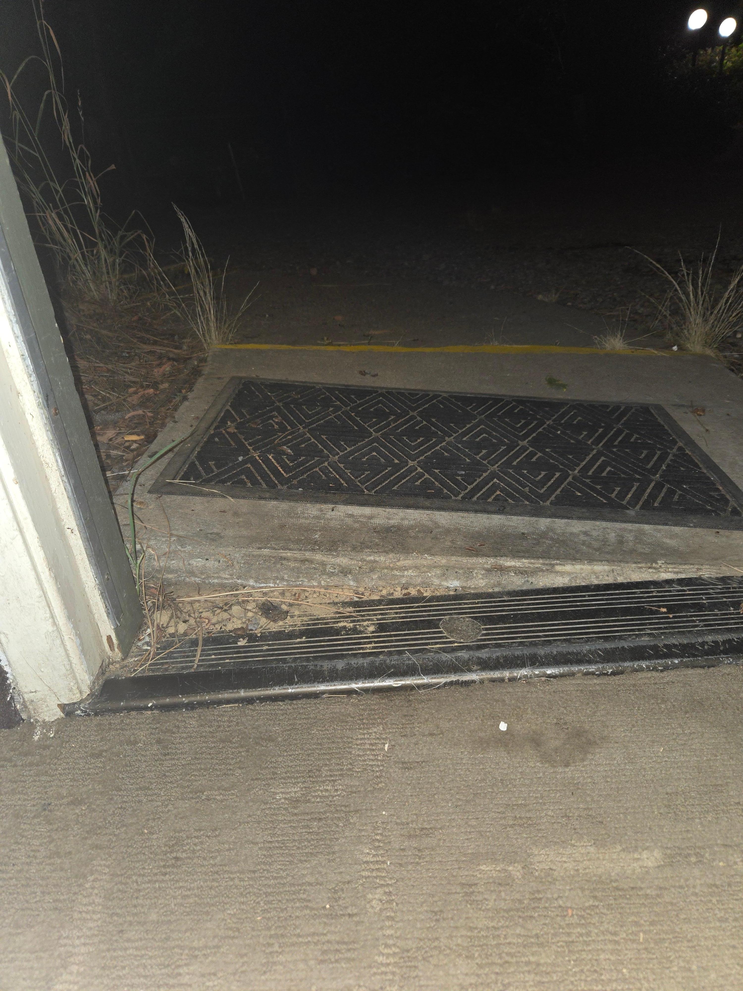 The slanted concrete step into the room