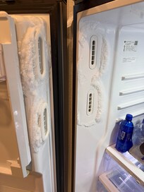 Ice maker was frozen and not producing ice.