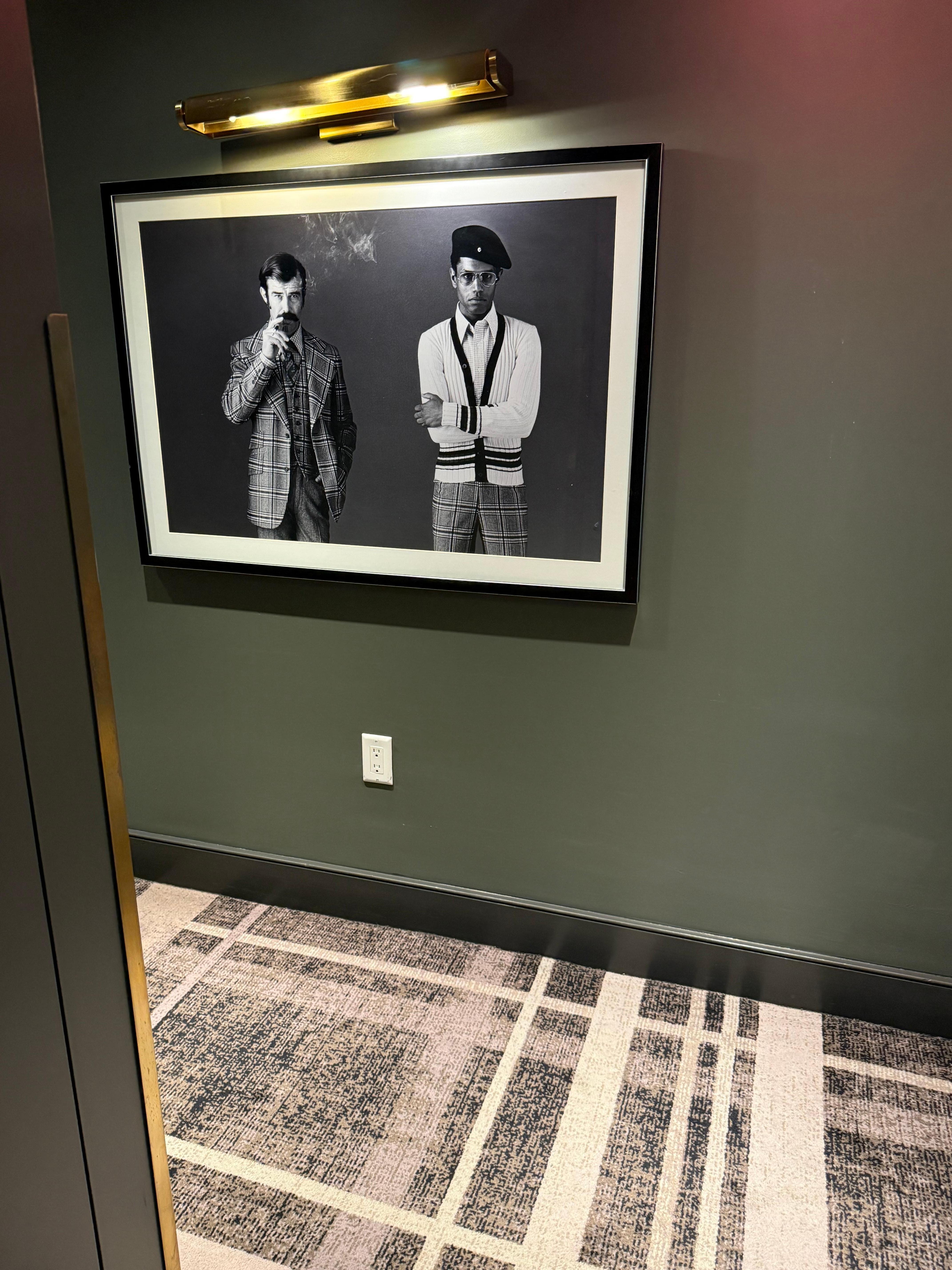 Nice carpet pattern and same pattern on clothes of people in photo. Nicely done. 