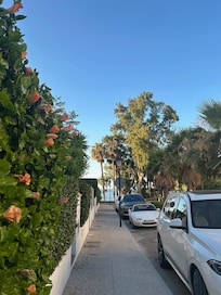 Street outside villa's entrance headed toward pool and beach.
