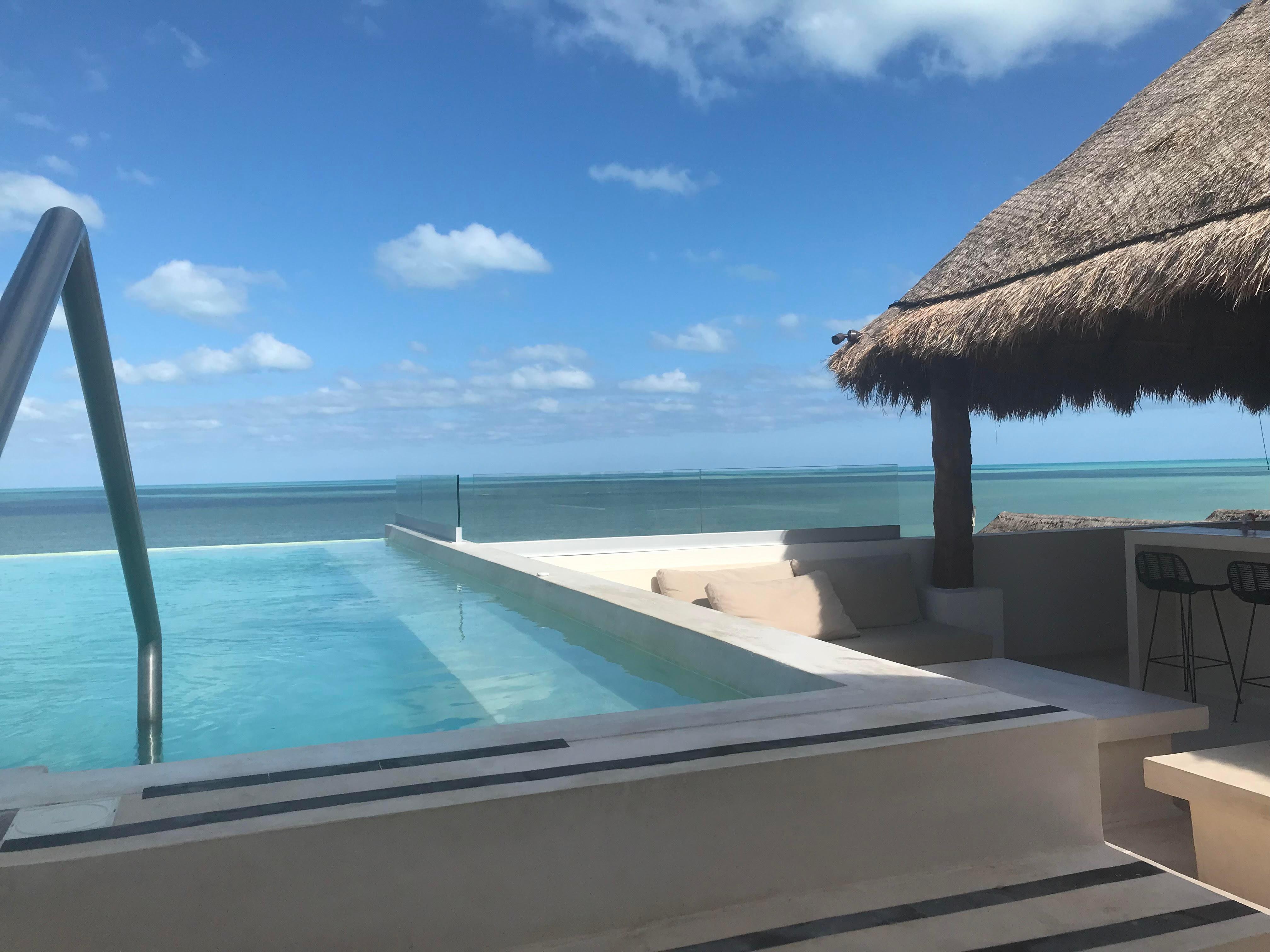 Rooftop terrace with bar and pool.