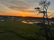 Beautiful view of the marsh from the rooftop deck at sunset.