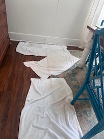 This is where the ac flood was and we had to put towels down. Rug was SOAKED. If you notice the towels are becoming a different color bc of mold