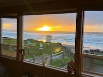 Sunset sit on the couch looking out the beautiful window windows