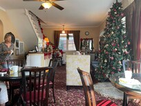 Lobby and bfast room - very chatty friendly owner serving bfast . Decorated for Xmas