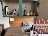 Dirt and trash underneath reclining couch