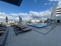 3rd floor spa pool area that anyone can use, and there is a hot tub too. This gets sun early in the morning until 2ish.