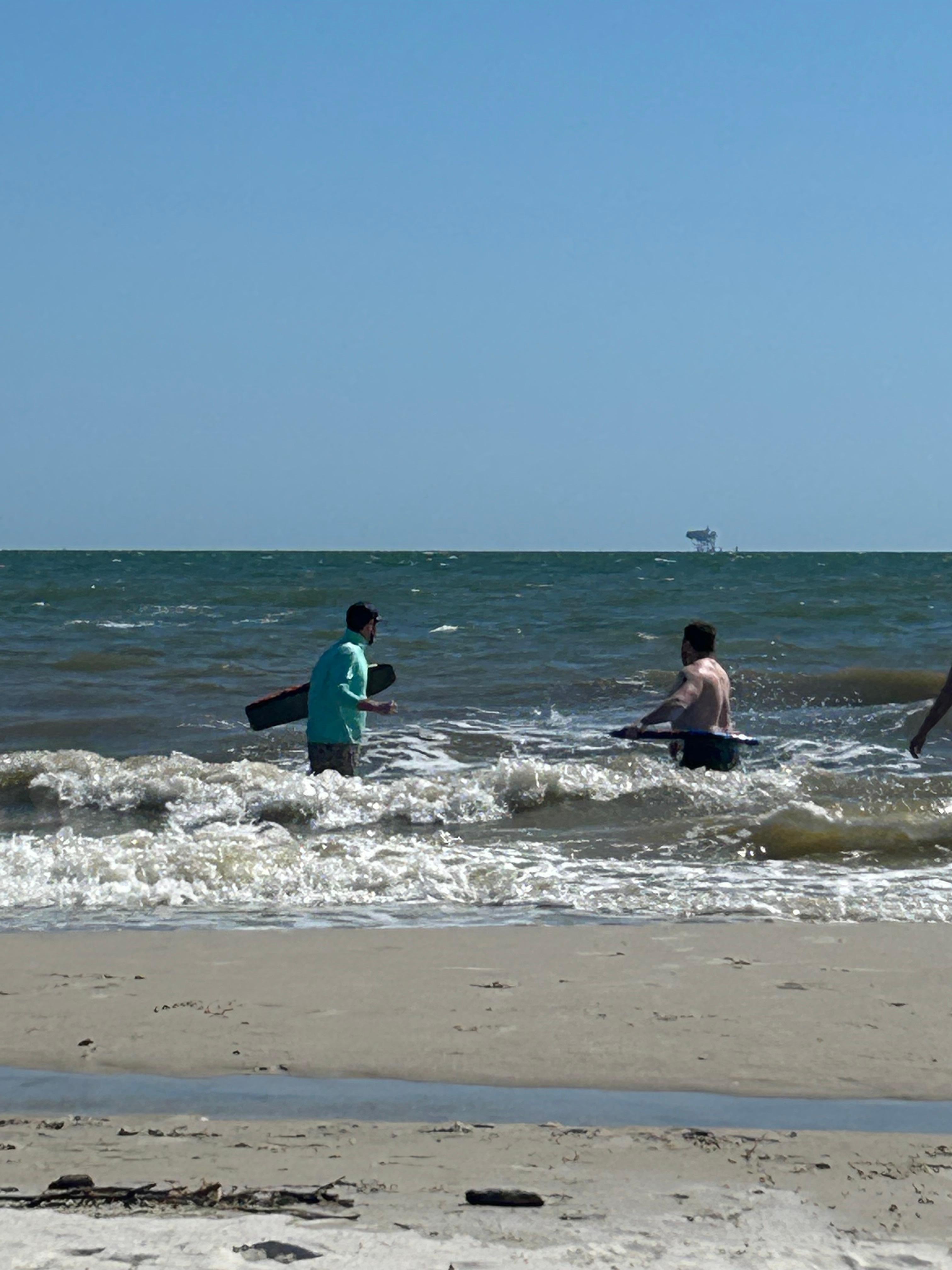 Sons enjoying the Ocean
