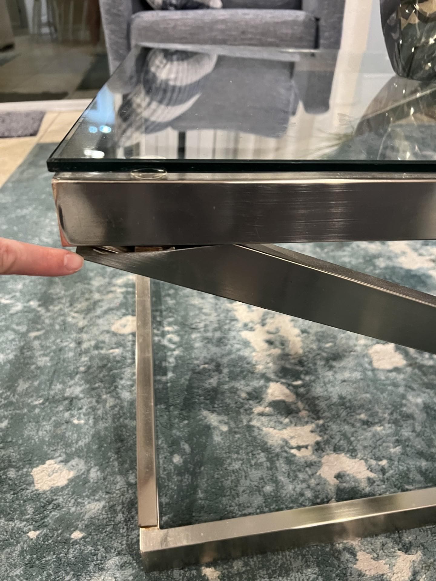 The table was broken and lopsided. Maintenance reviewed and swapped the table with a coffee table in the corner of the room