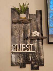 It's the light, welcoming touches for me. Makes you want to settle right in.