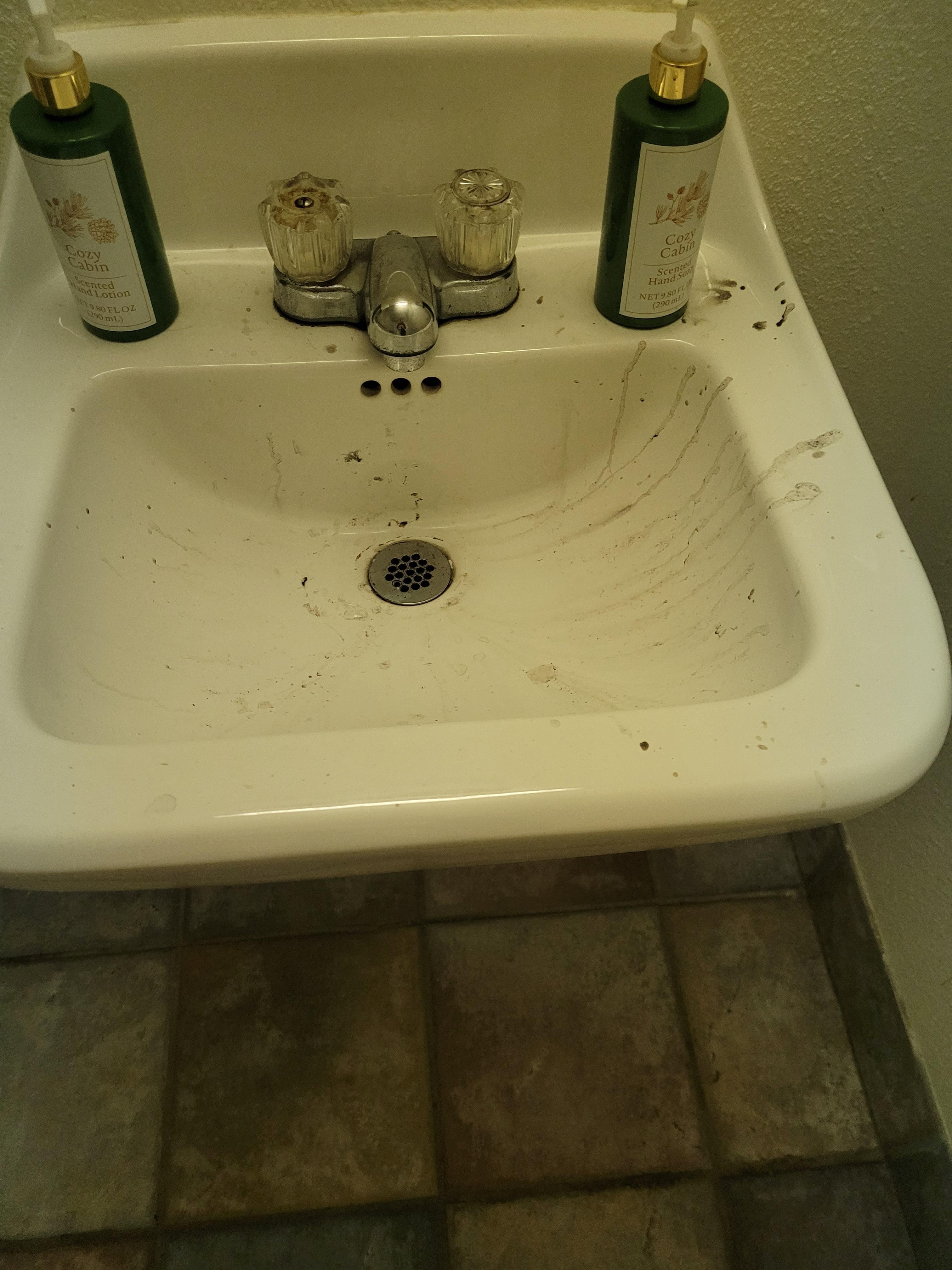Dirty sink in lobby bathroom