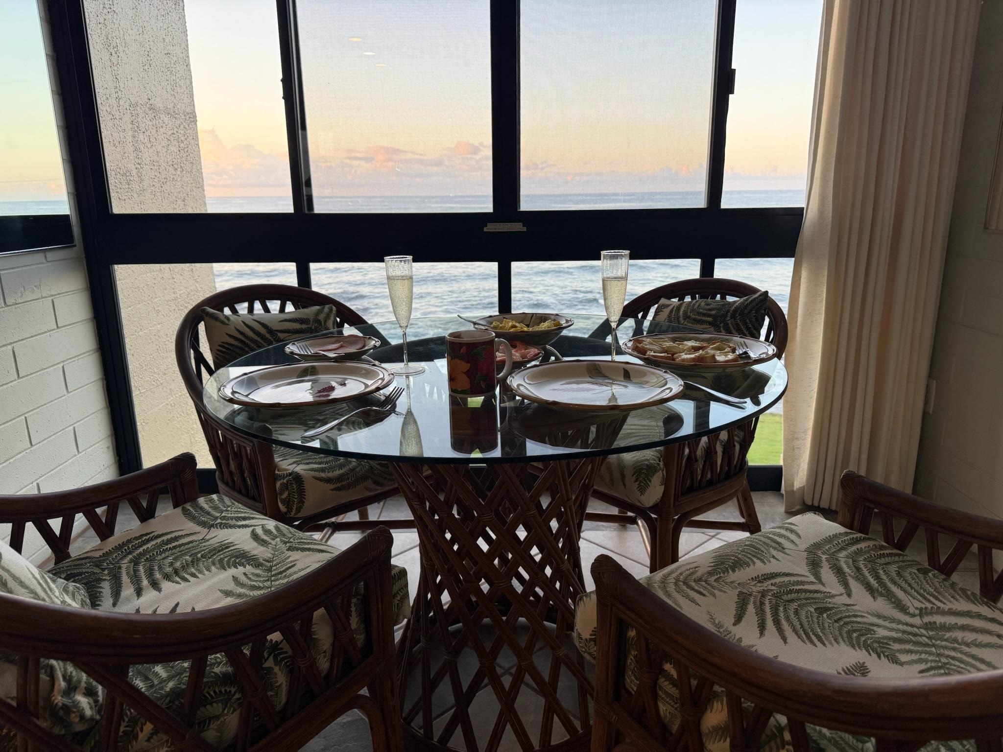 View of ocean from kitchen table - open windows for morning breeze and sound of waves!!!!