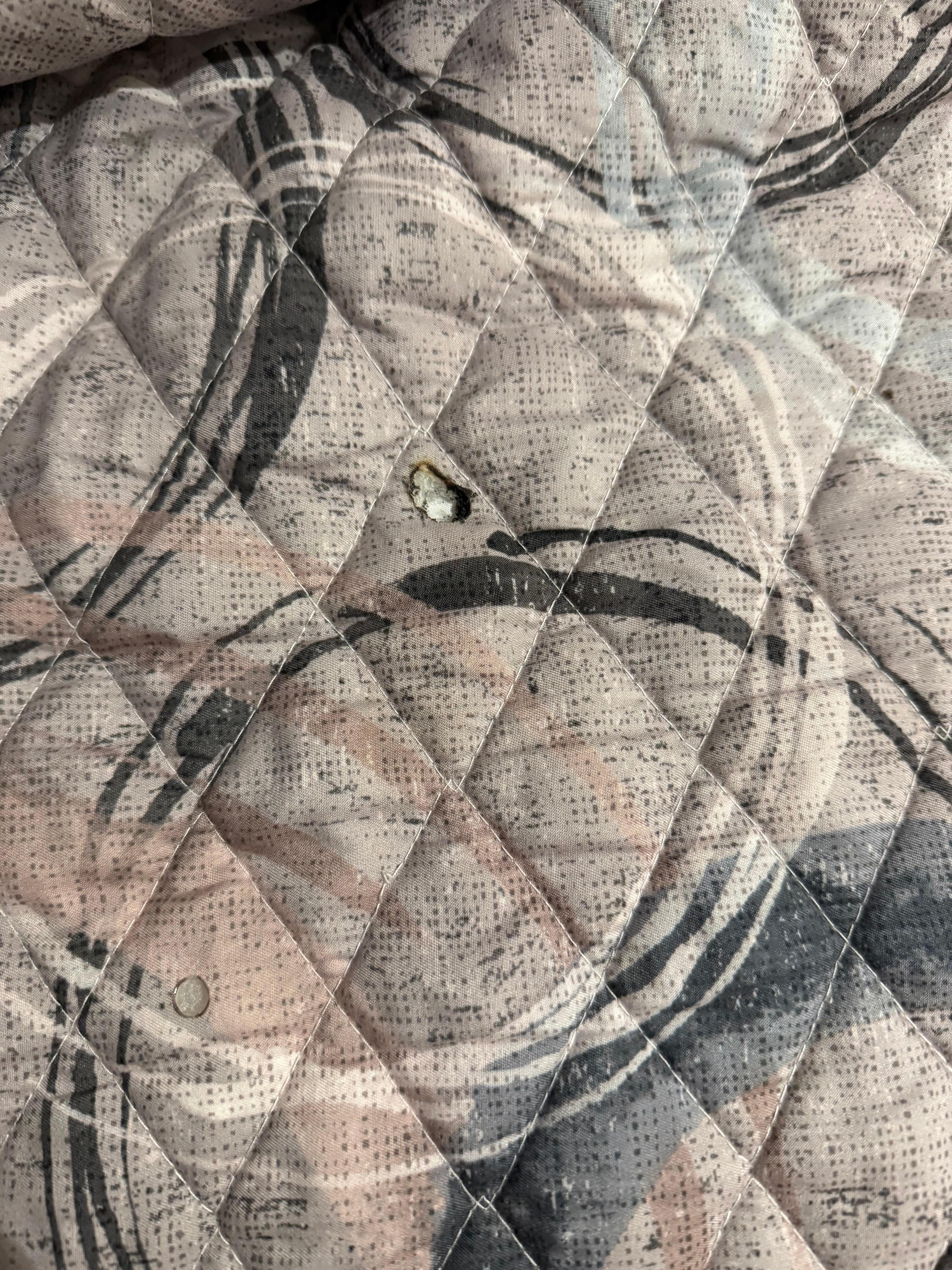 Cigarette burn on my other bed sheet