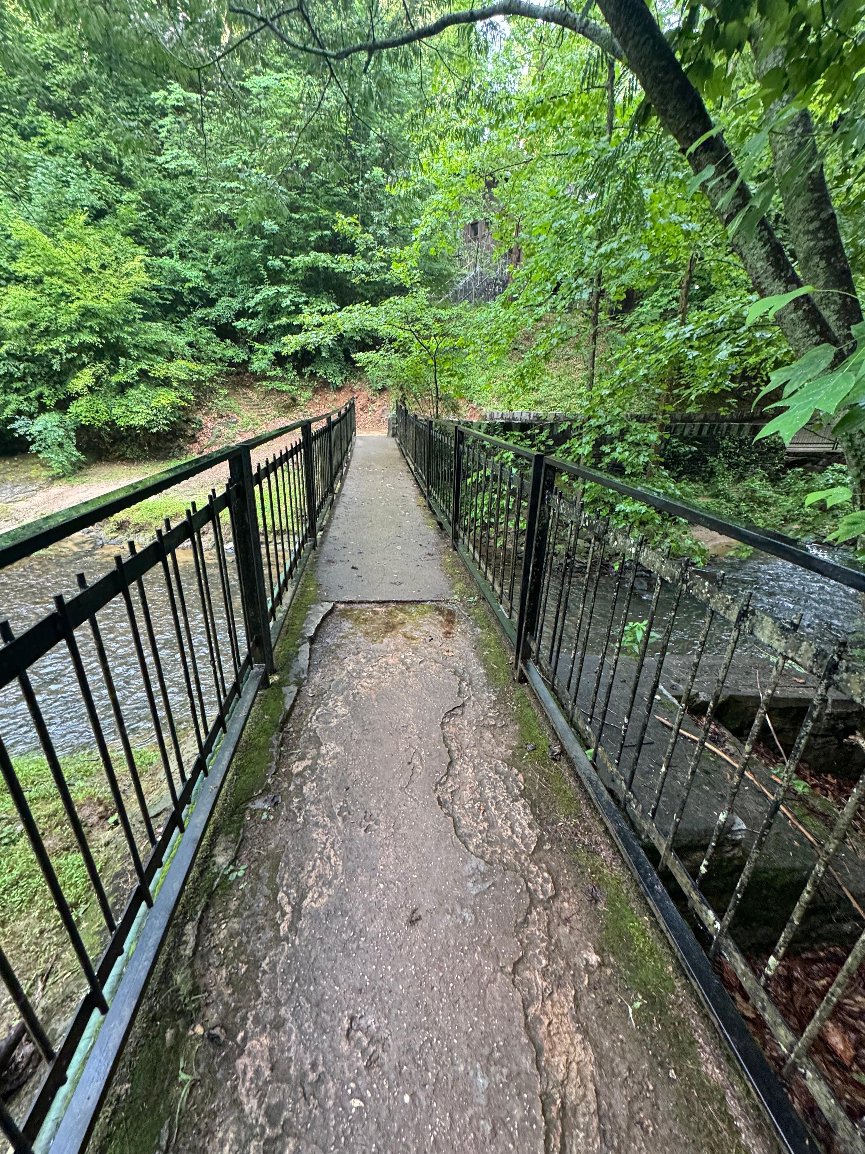 Walking bridge to property from parking lot 