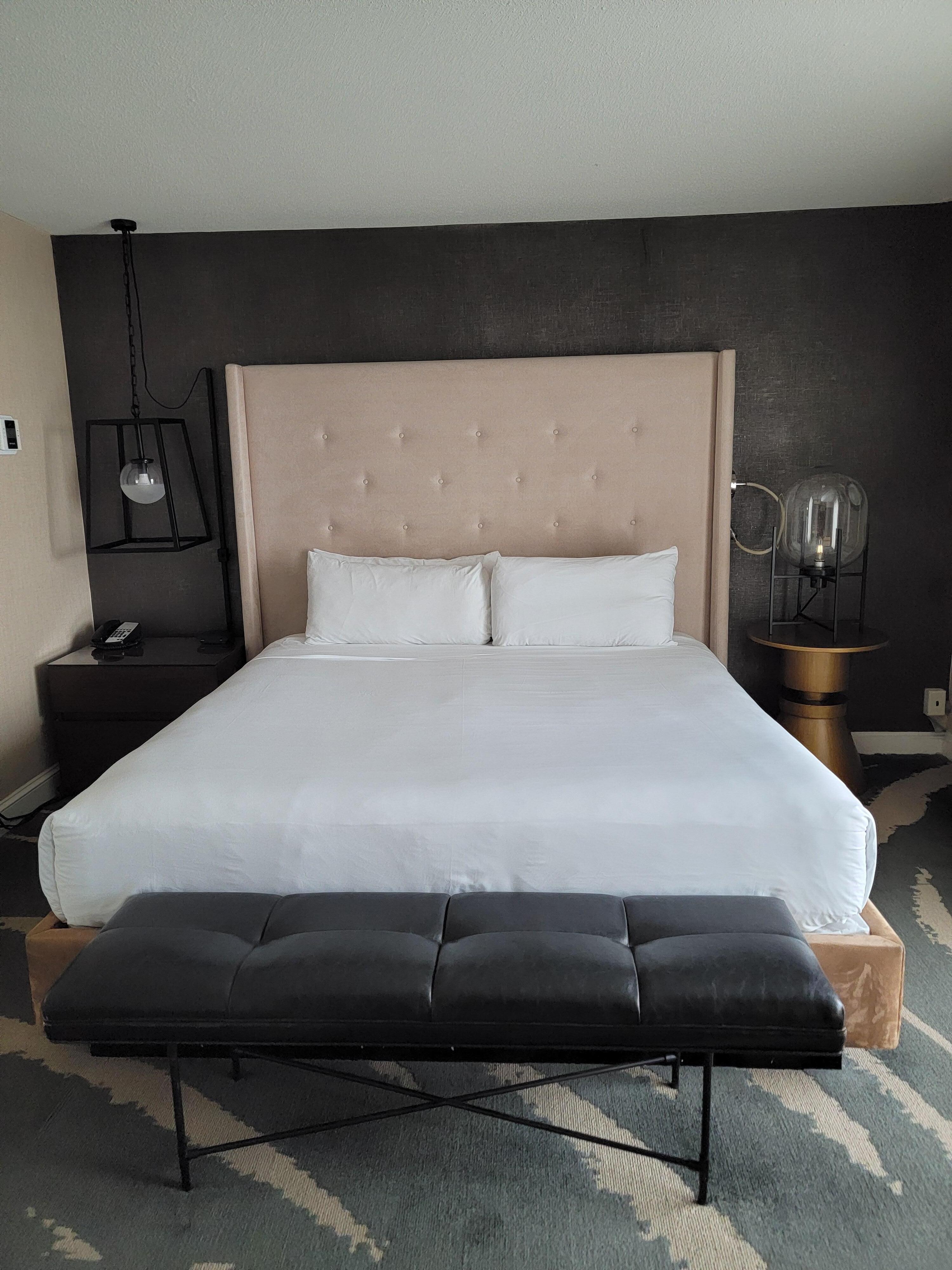 Bed in bedroom section of suite