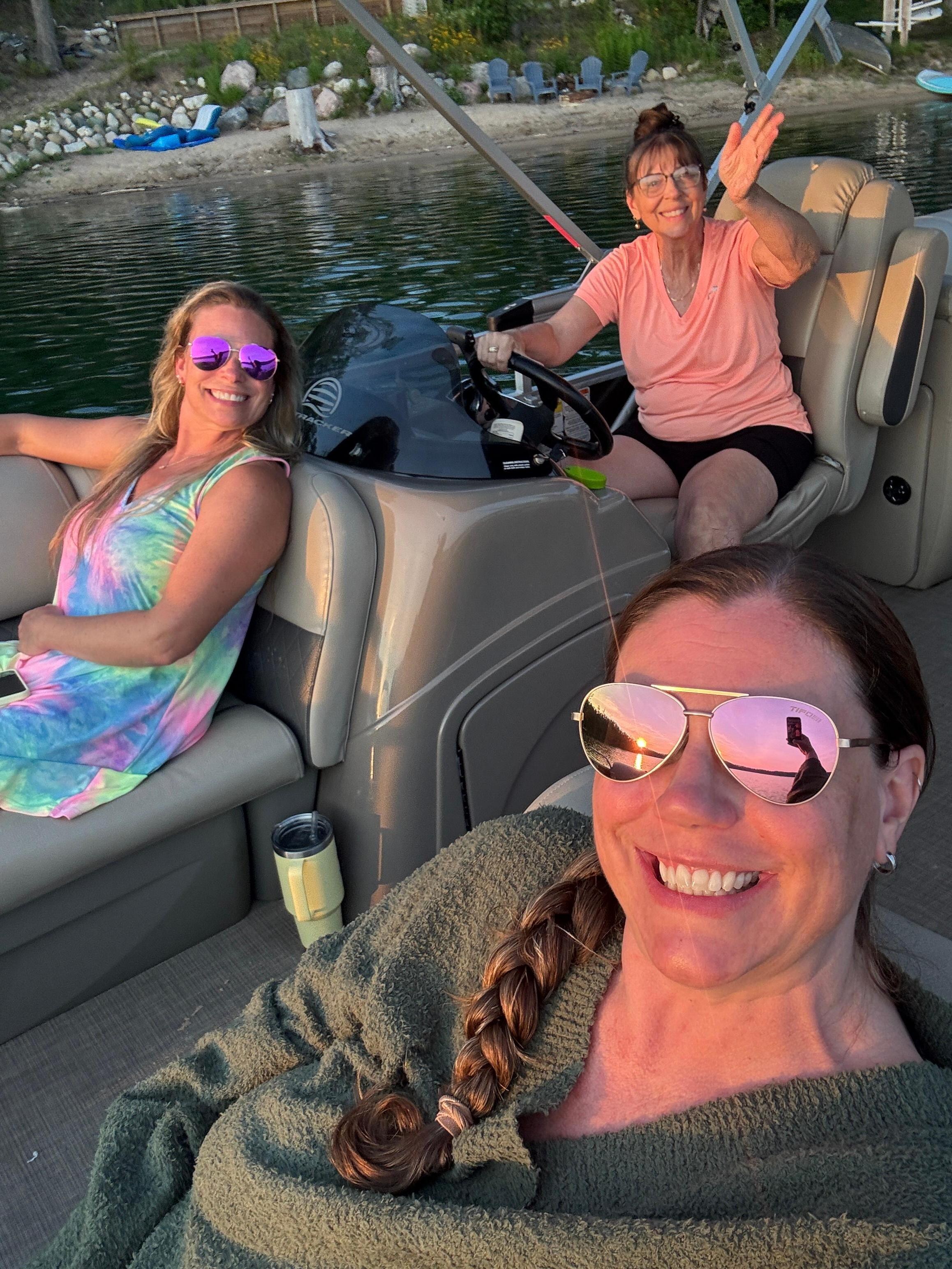 My daughters and I cruising the lake on our rented pontoon.