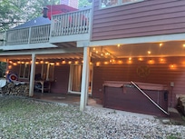 Back patio area with hot tub
