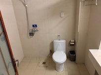 The bathroom is a "wet" bath, so there's no divider for the shower. Plenty of hot water though, with good water pressure.