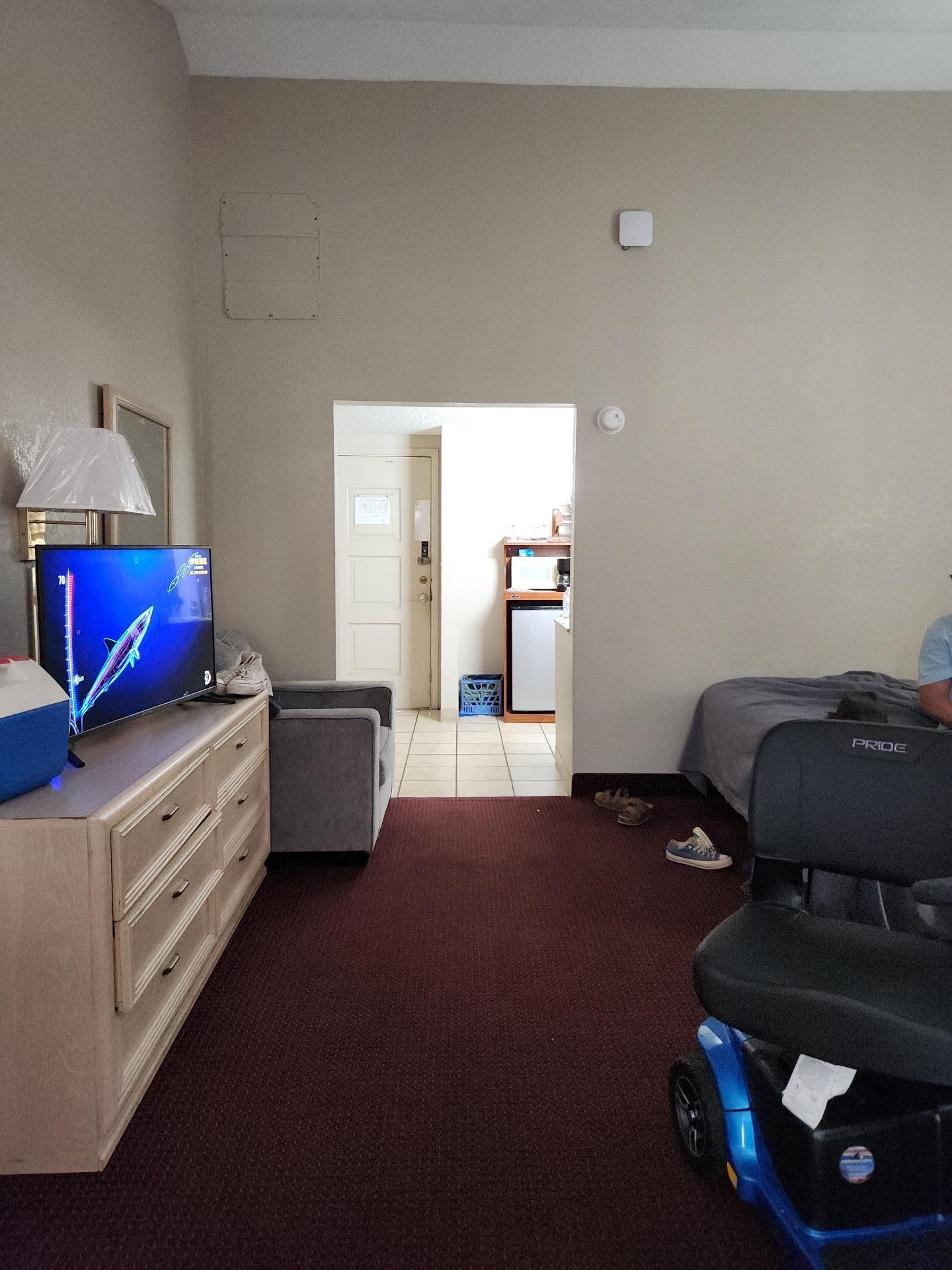 Great size room 2 beds arm chair dinette table and 2assitive scooters we still had plenty of space bathroom was functional but in need tsome tlc