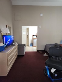 Great size room 2 beds arm chair dinette table and 2assitive scooters we still had plenty of space bathroom was functional but in need tsome tlc