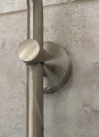 Broken shower spraying water everywhere