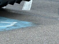 We tried to drive around to capture GM having an employee sand handicapped emblem off cement