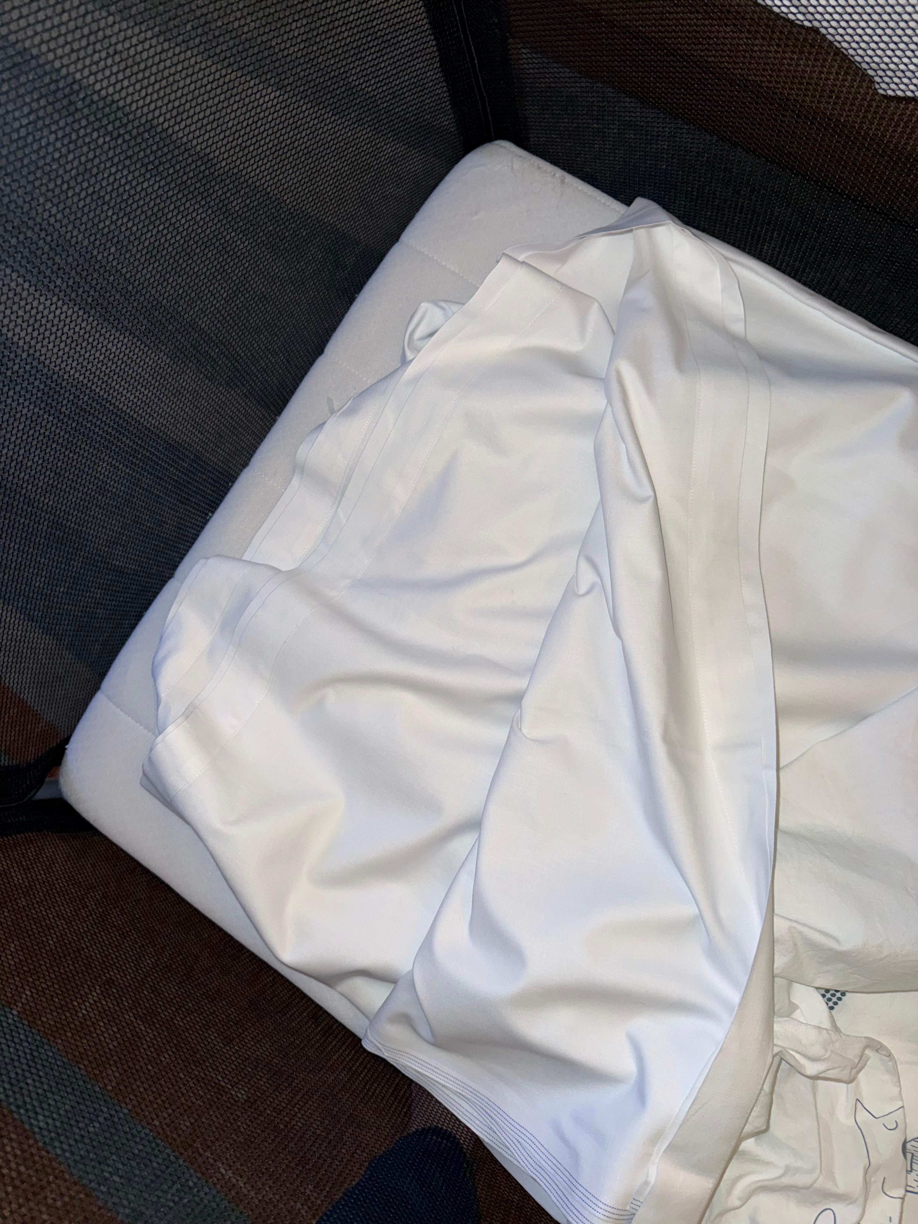 Double sheet folded in cot 